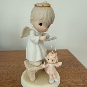 Precious Moment figurine
The Good Lord will always Uphold Us.